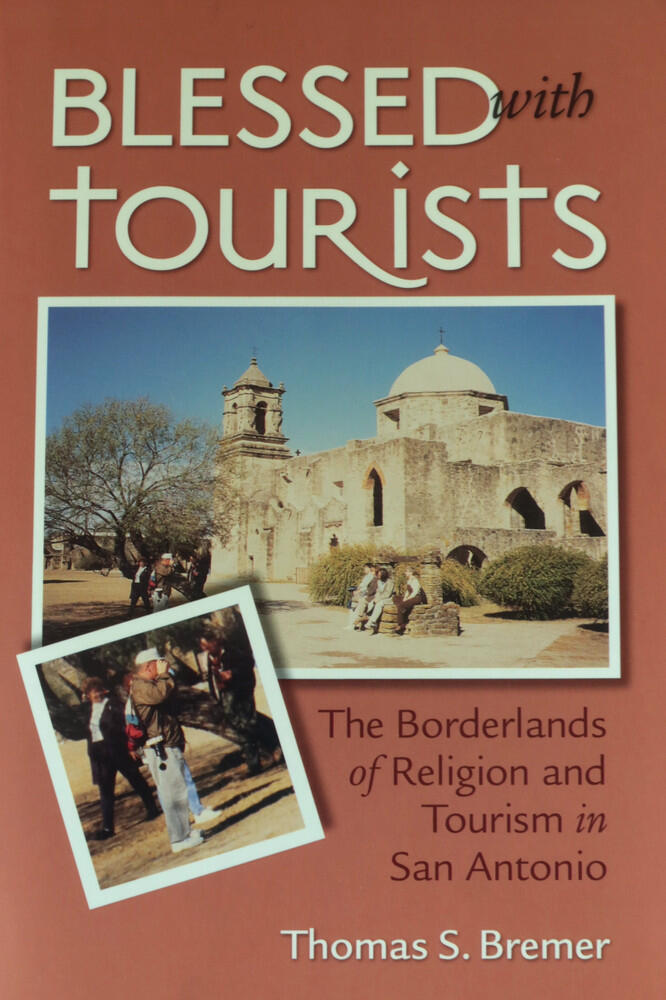 Blessed with Tourists book cover The cover of the book Blessed with Tourists features a historic San Antonio Spanish mission church with visitors outside, while an inset photo in the lower left shows a tourist getting a photo. Author: Thomas S. Bremer.